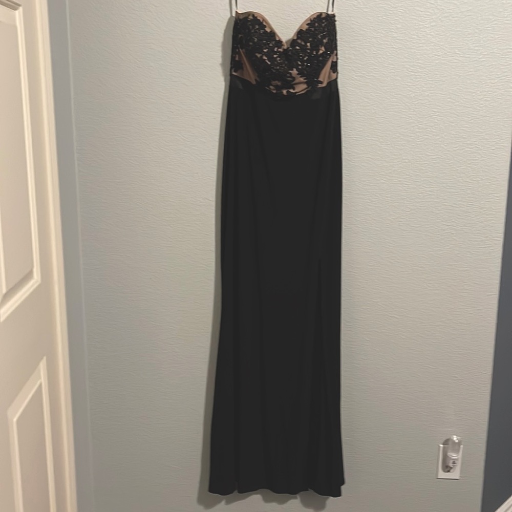 Black Jump Apparel by WendyeChcilin dress with beading on top. Size is 11/12